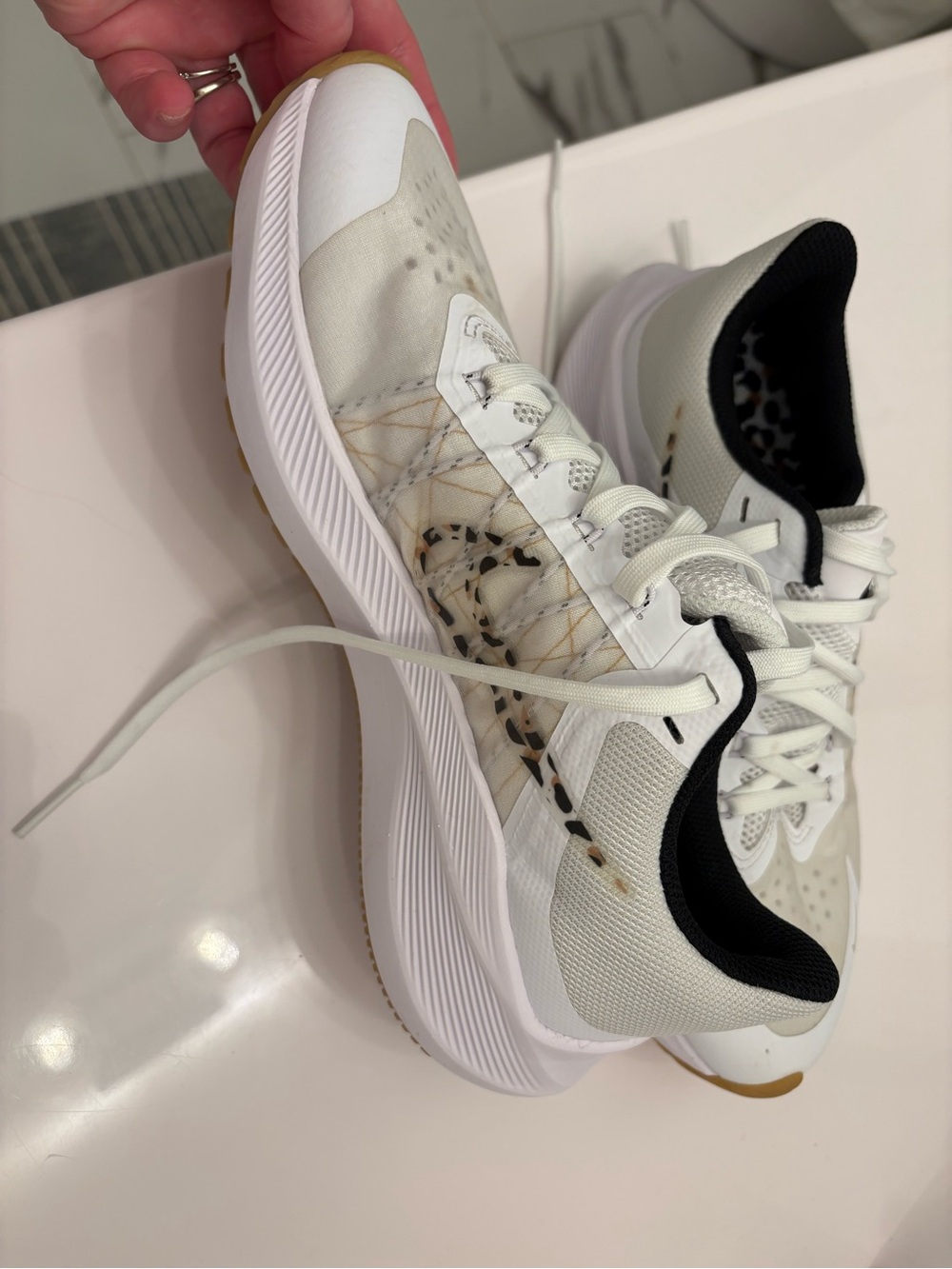 Nike Women's White Athletic Sneakers with Leopard Print Accent and Gum Sole